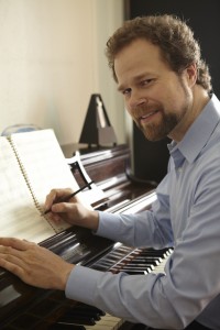 Composer David Wallace at the Piano Photo Credit: Christopher Davis