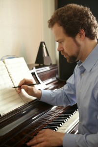 David Wallace Composing at the Piano Photo Credit: Christopher Davis