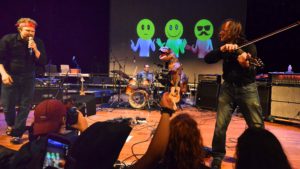 The Chuck and David Show: Chuck Bontrager and David Wallace perform Nirvana's Breed, replete with a thrash-dancing dinosaur